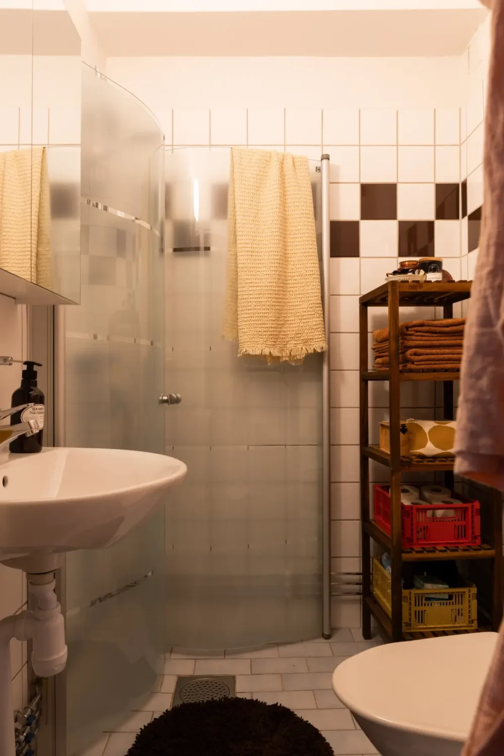 A Warm Beige Studio Apartment with a Butter-Yellow Kitchen 22 bathroom