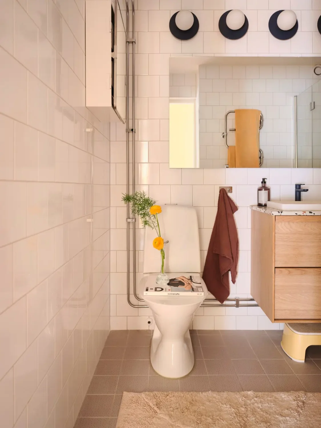 Soft Beige Interiors with the Occasional Bright Color Pop in Stockholm 27 bathroom dresser terrazzo top