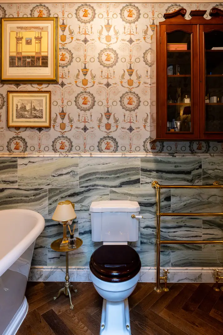 A Mixture of Patterns, Colors, and Materials in a Stunning London Apartment 21 bathroom iksel wallpaper green marble tiles nordroom
