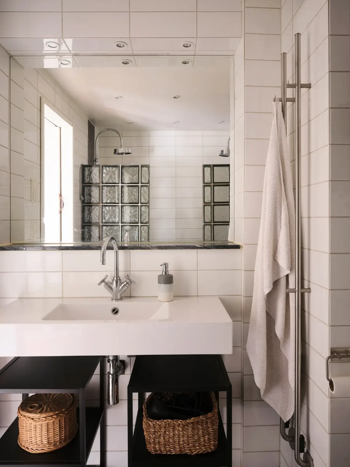 Exposed Beams and Dark-Stained Floorboards in a Cozy Attic Apartment 17 bathroom white tiles double showers