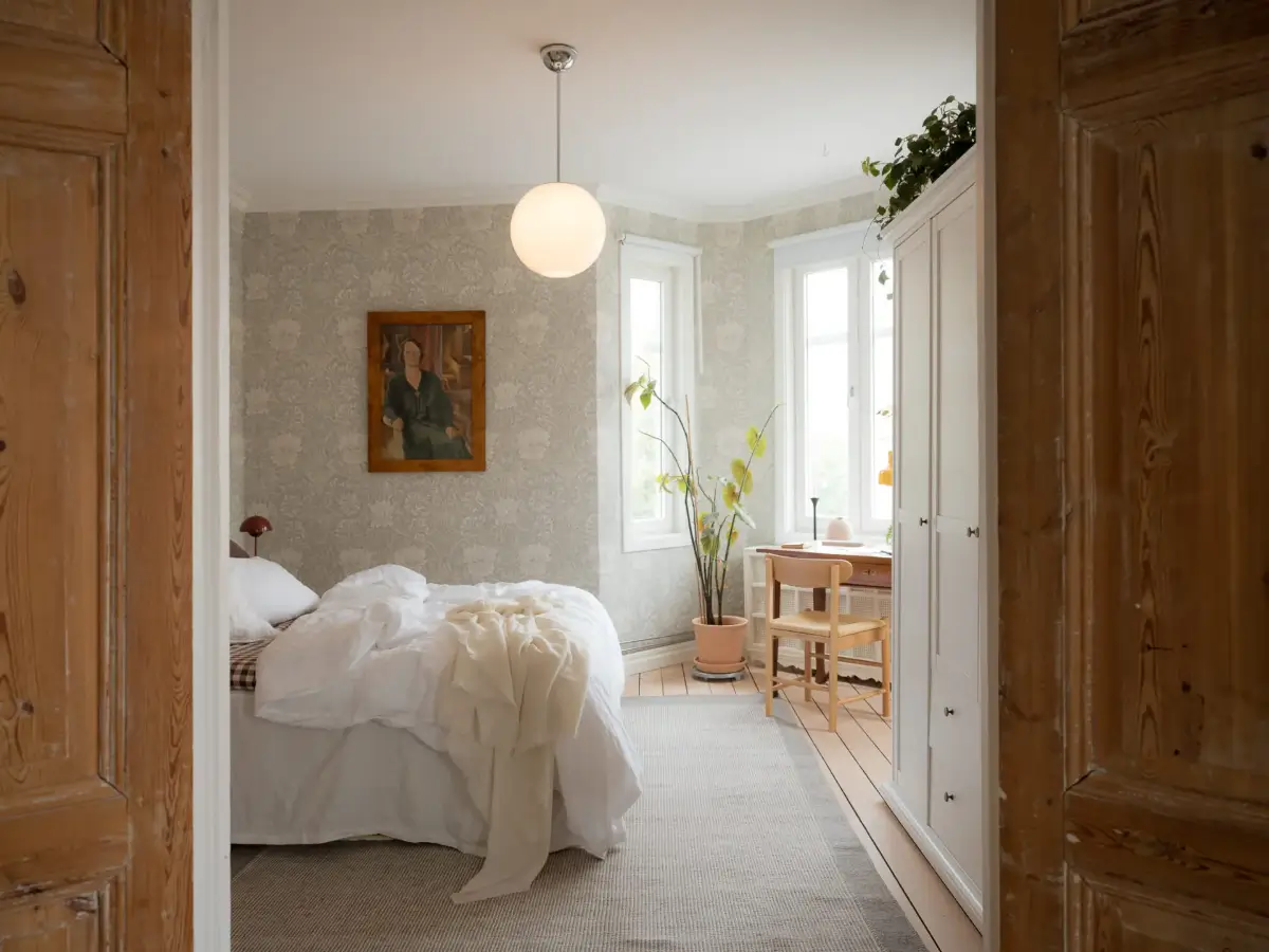 A Cozy Apartment with Exposed Brick and Period Details 9 bedroom gray floral wallpaper