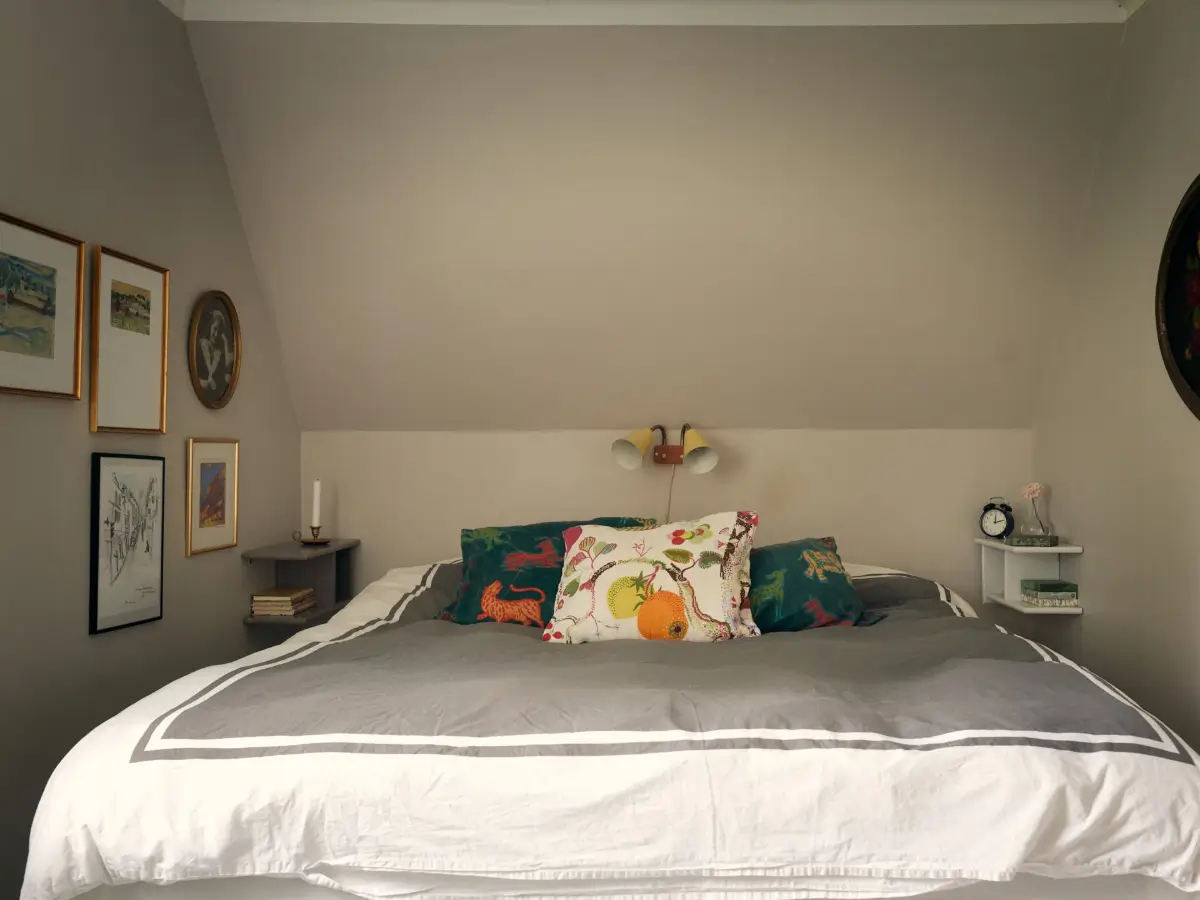 A Cheerful Color Palette in an Early 20th Century Villa in Stockholm 24 bedroom slanted ceiling