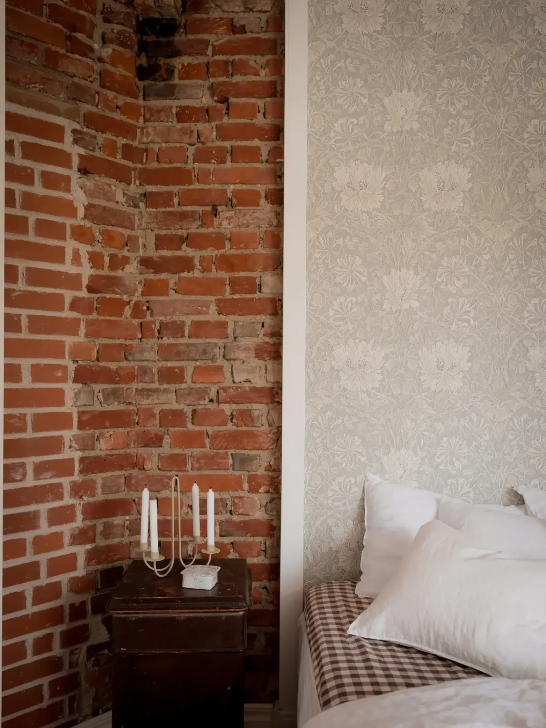 A Cozy Apartment with Exposed Brick and Period Details 14 bedroom wallpaper brick wall detail