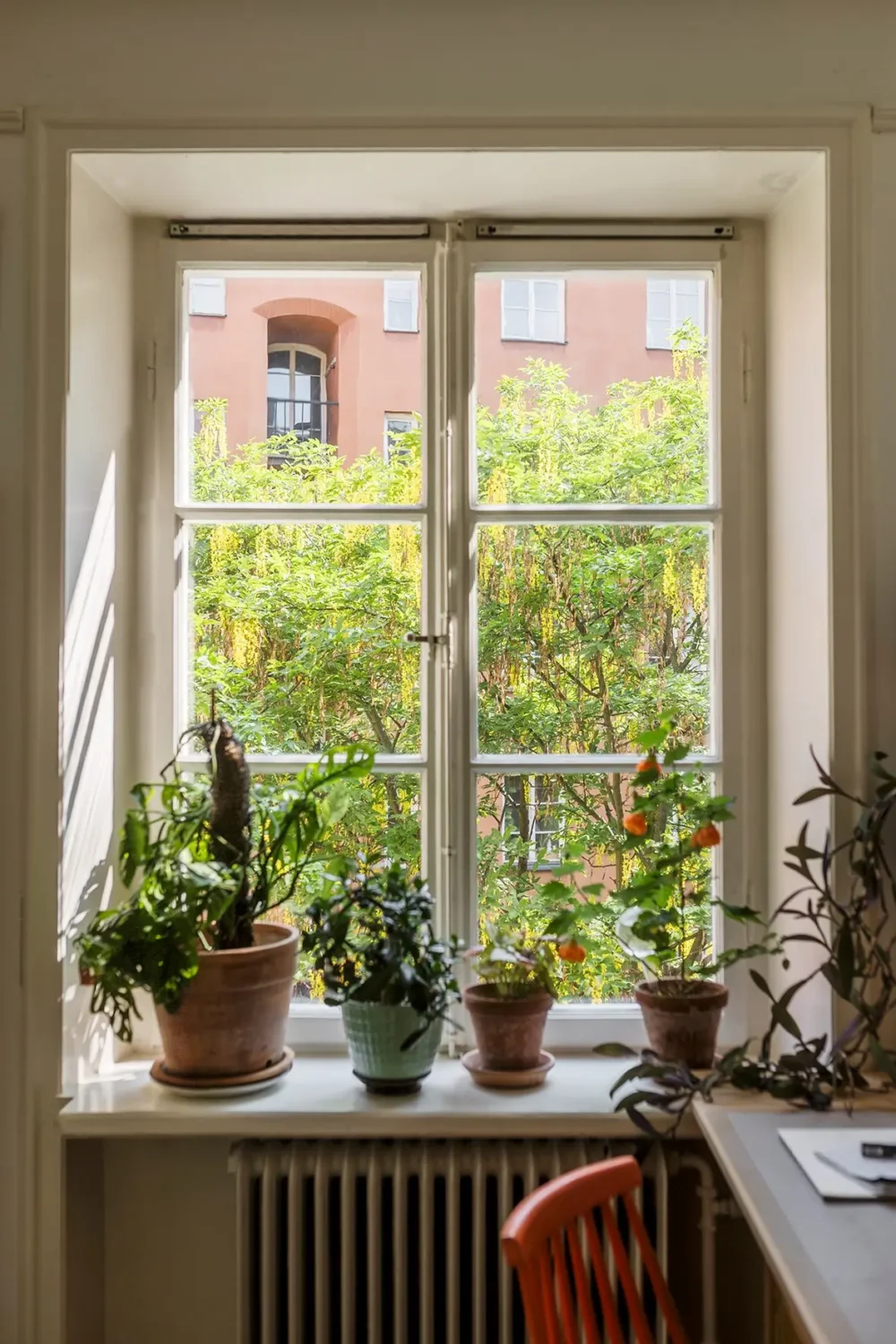 A Charming Swedish Courtyard Apartment Filled with Art 16 bedroom window