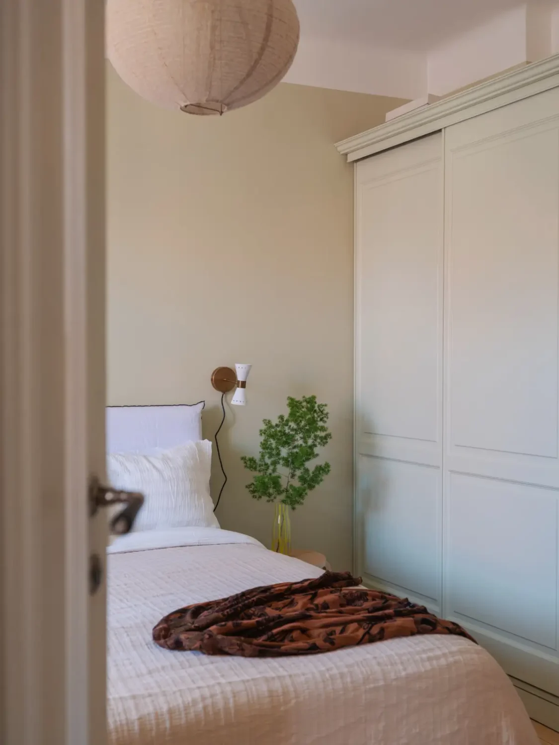 A Bright Apartment Where Historic Character Meets Contemporary Design 15 beige bedroom