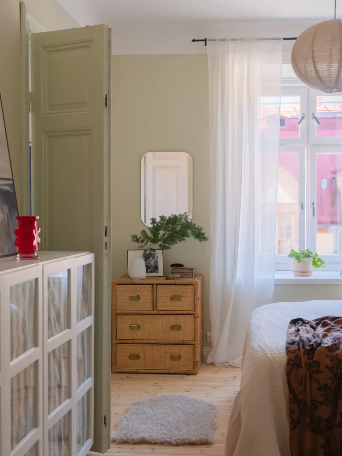 A Bright Apartment Where Historic Character Meets Contemporary Design 11 beige bedroom wooden floor