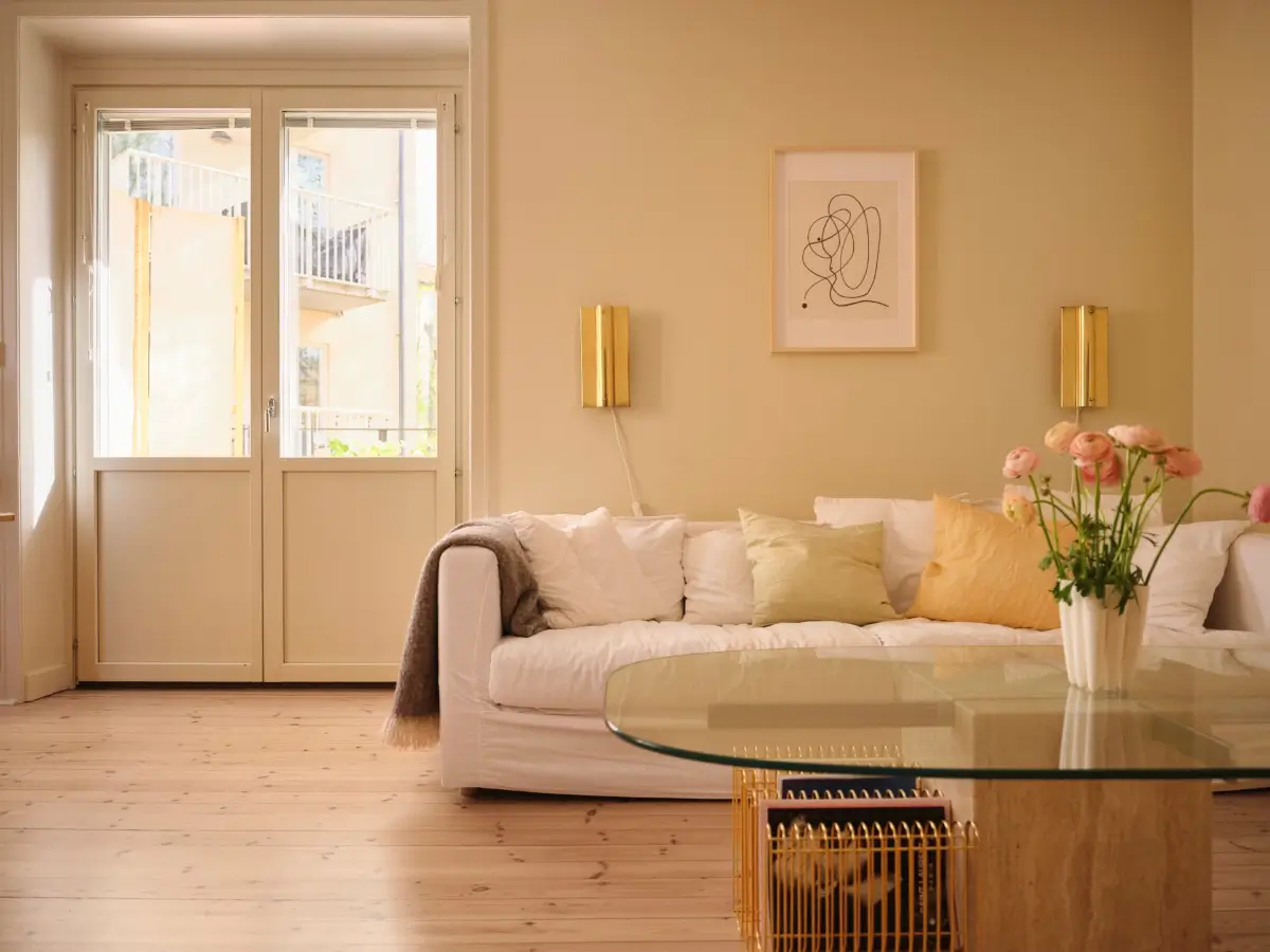 Soft Beige Interiors with the Occasional Bright Color Pop in Stockholm 8 beige living room white sofa