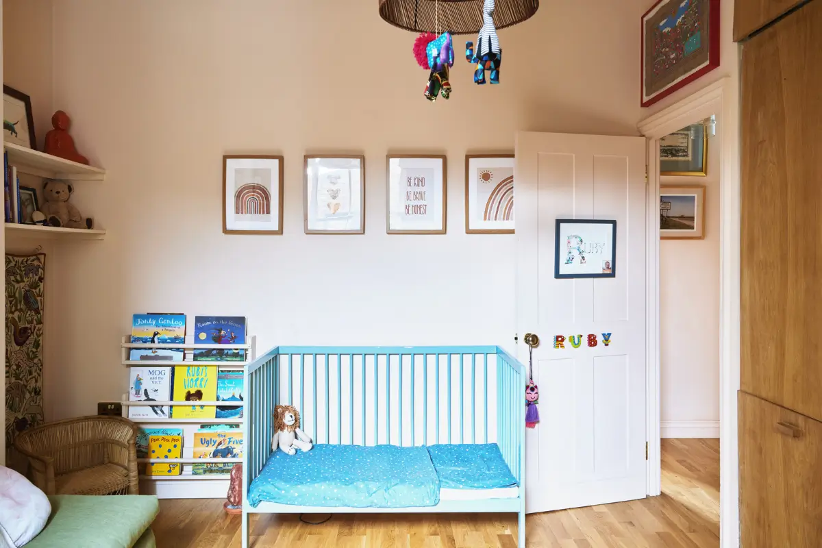 An Extended Victorian Apartment with Exposed Brick Walls 12 beige-pink nursery