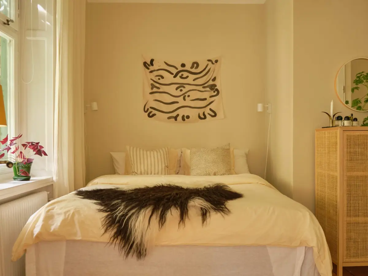 A Lush Balcony and Charming Rooms in a Late 19th Century Apartment 13 beige-yellow bedroom