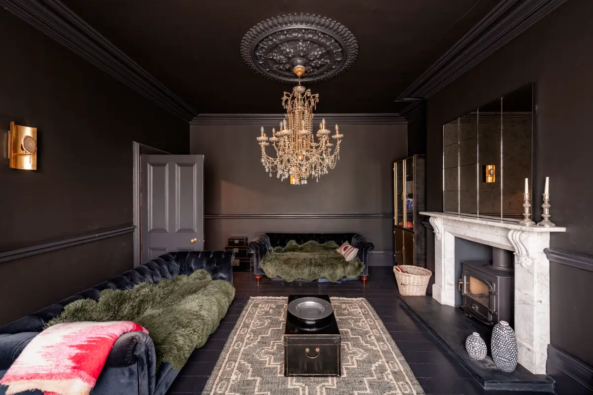 A Dramatic Color Palette in a Large Victorian Family Townhouse 2 black living room blue velvet sofas