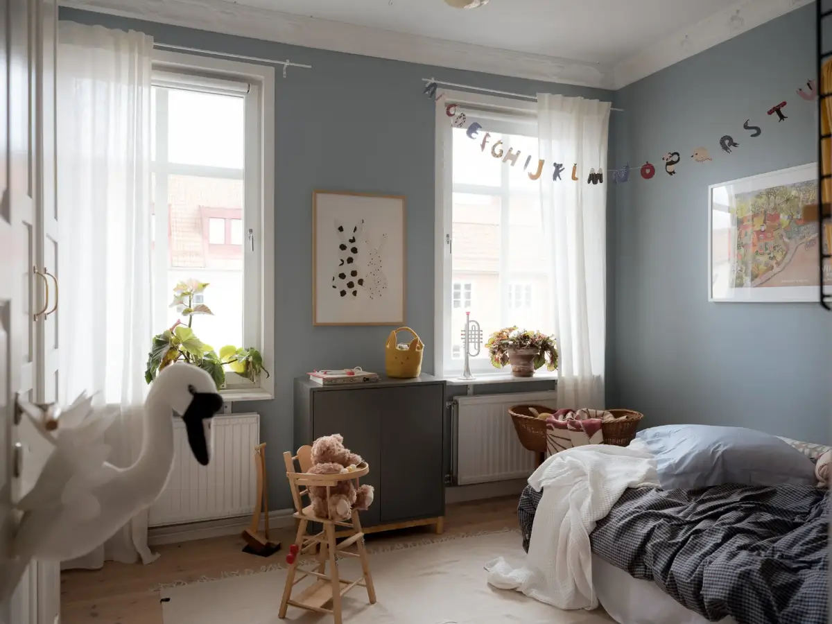 A Cozy Apartment with Exposed Brick and Period Details 25 blue-gray kids bedroom
