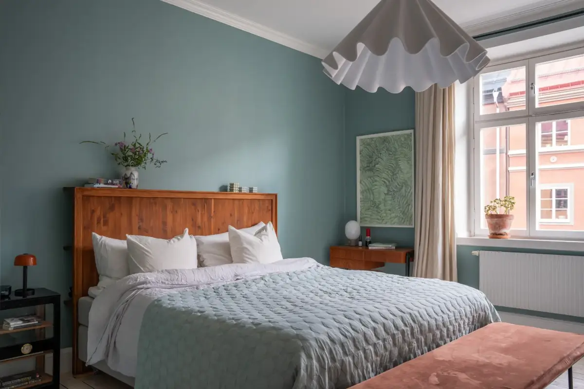 A Light Turn-of-the-Century Apartment with a Blue Kitchen 20 blue scandi bedroom