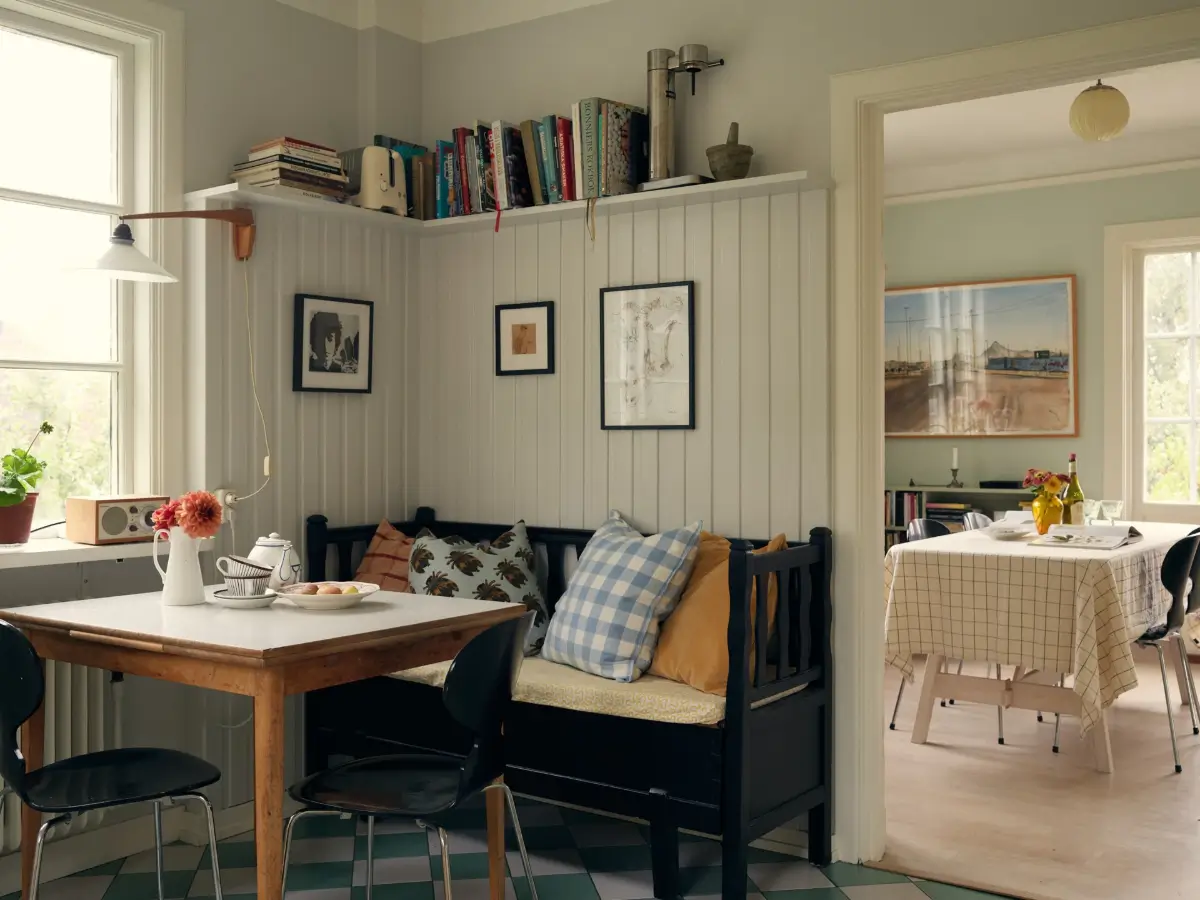 A Cheerful Color Palette in an Early 20th Century Villa in Stockholm 14 breakfast nook with bench and paneling