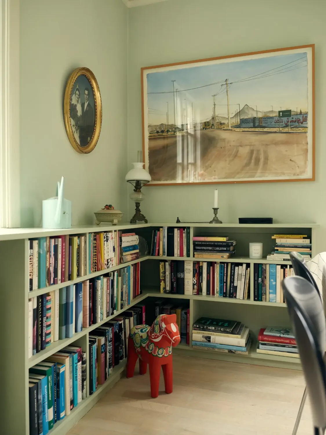 A Cheerful Color Palette in an Early 20th Century Villa in Stockholm 8 built-in bookshelves