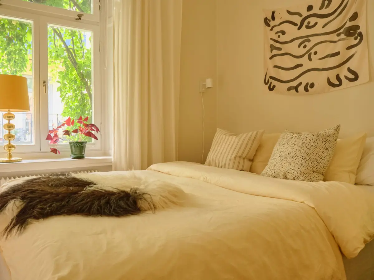 A Lush Balcony and Charming Rooms in a Late 19th Century Apartment 14 butter yellow bedroom