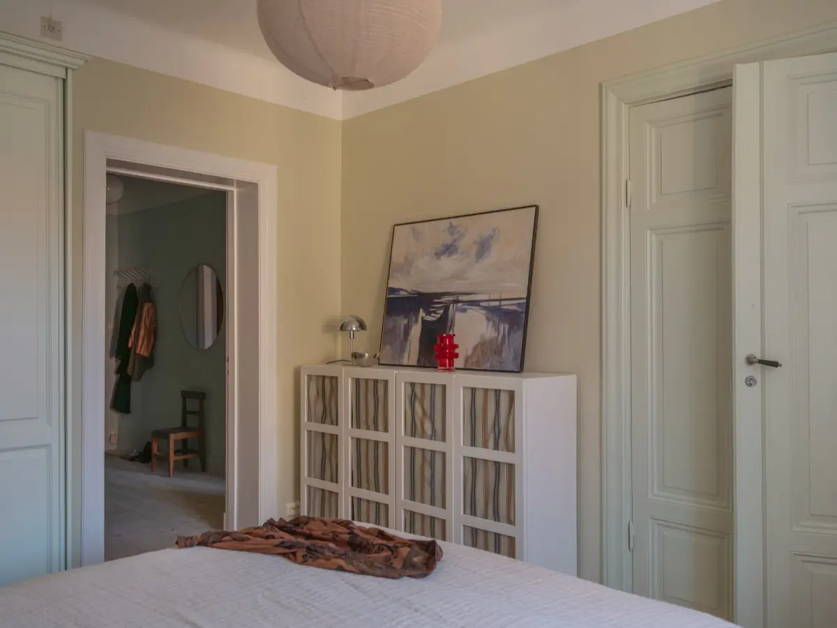 A Bright Apartment Where Historic Character Meets Contemporary Design 13 cabinets glass doors with fabric