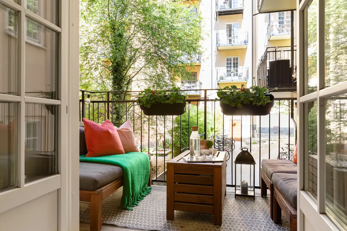 Red and Blue Color Accents in an Open-Plan Stockholm Apartment 6 courtyard balcony glass doors