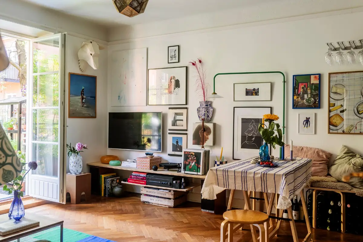 A Charming Swedish Courtyard Apartment Filled with Art 1 cozy living room art herringbone parquet floor