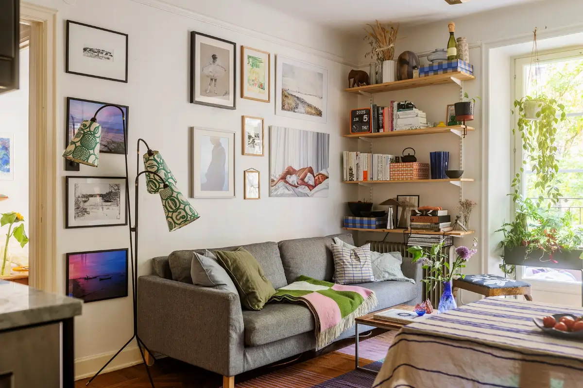 A Charming Swedish Courtyard Apartment Filled with Art 3 cozy living room with art and shelves
