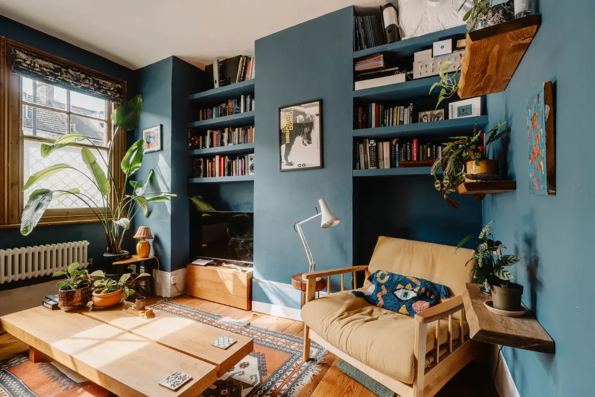 dark blue living room built-in shelves