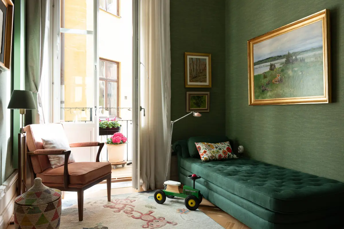 A Luxurious Family Apartment with a Dramatic Black Bathroom 15 dark green wallpaper sitting room