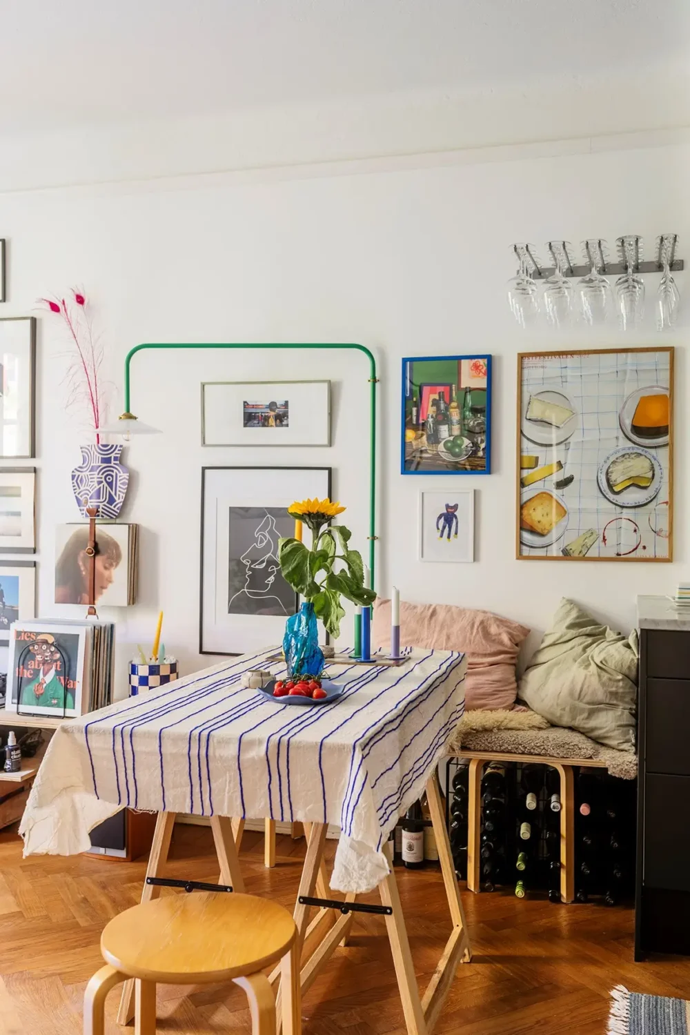 A Charming Swedish Courtyard Apartment Filled with Art 7 dining room blue striped tablecloth
