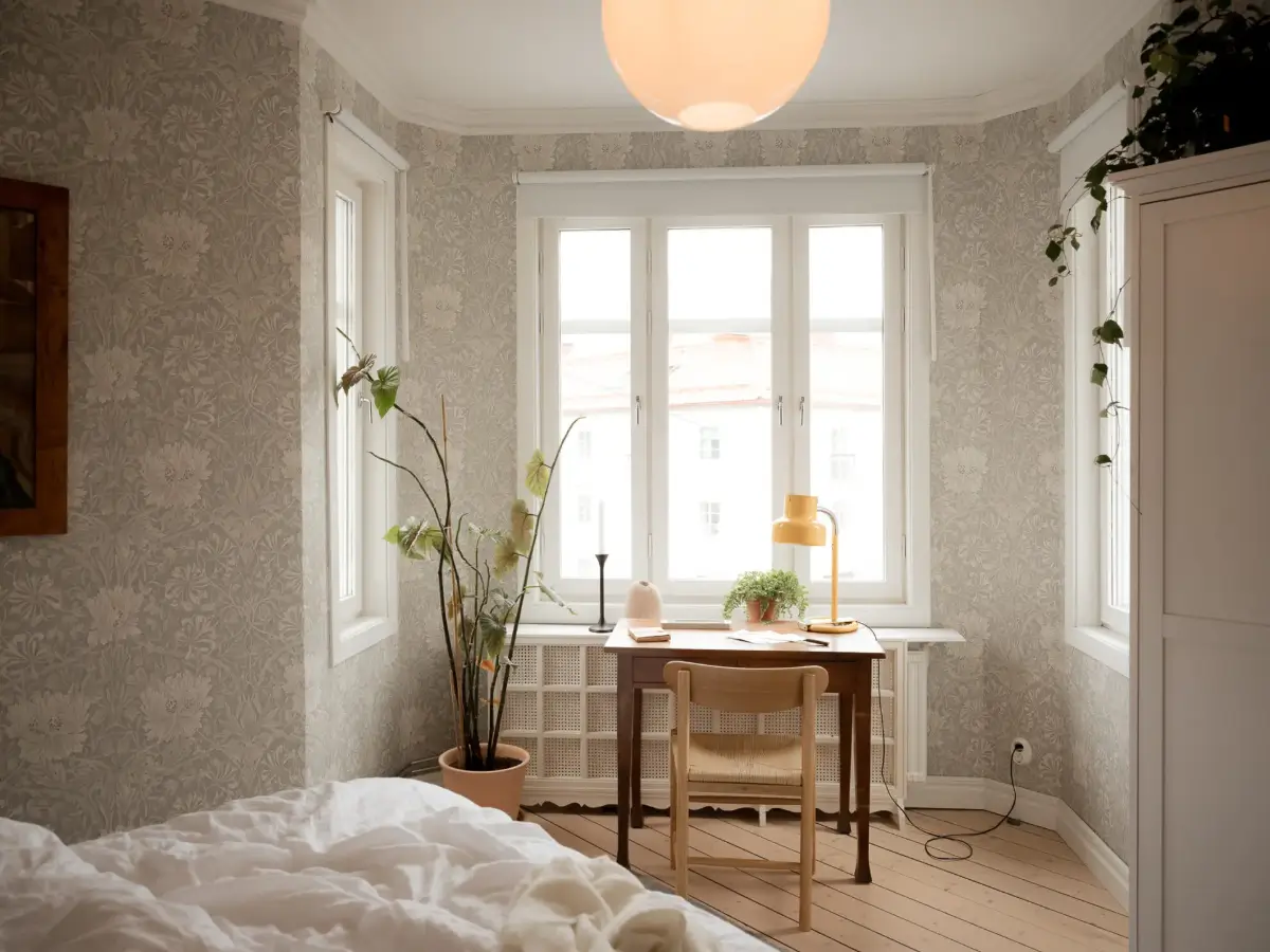 A Cozy Apartment with Exposed Brick and Period Details 13 floral wallpaper bedroom desk