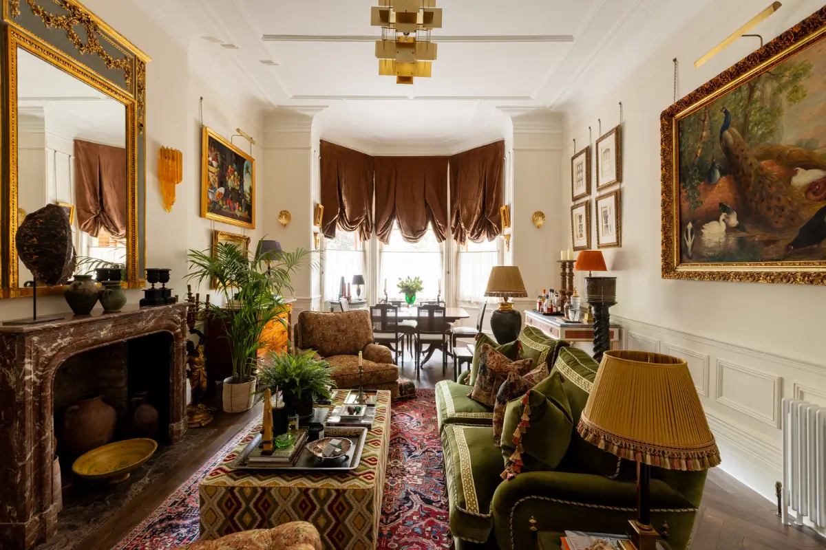 A Mixture of Patterns, Colors, and Materials in a Stunning London Apartment 1 grand living room bay window marble fireplace layered textiles nordroom