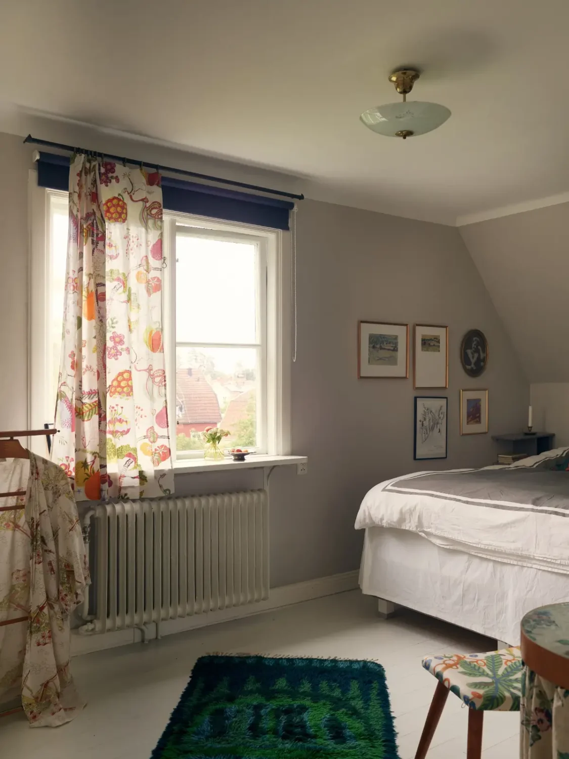 A Cheerful Color Palette in an Early 20th Century Villa in Stockholm 23 gray bedroom white floorboards