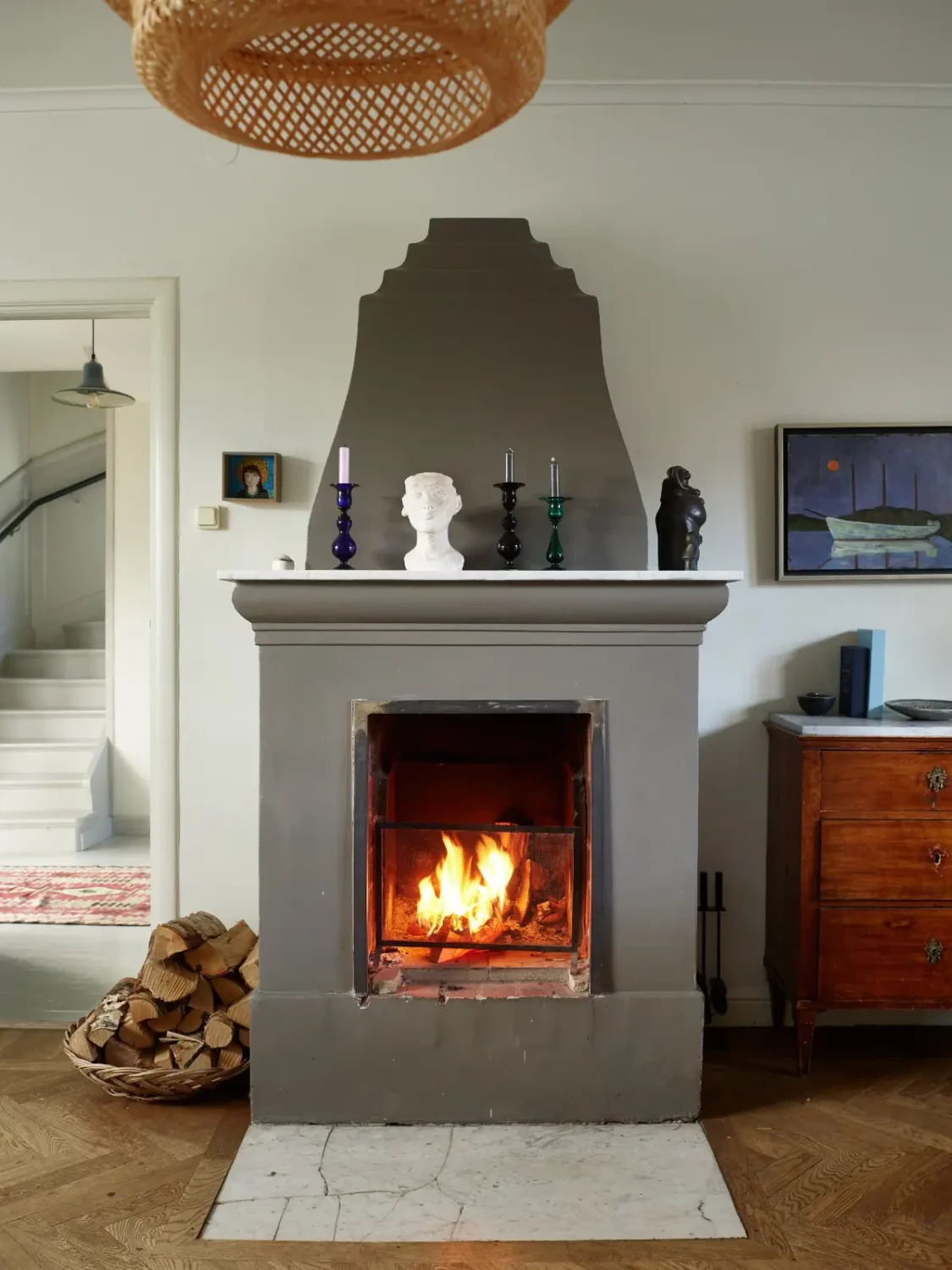 A Well-Preserved 1920s House with a Green Kitchen in Stockholm 11 gray fireplace