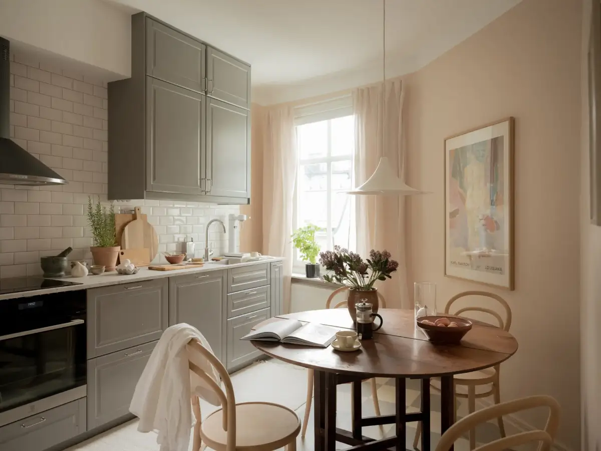 A Cozy Apartment with Exposed Brick and Period Details 19 gray kitchen with round table checkered floor