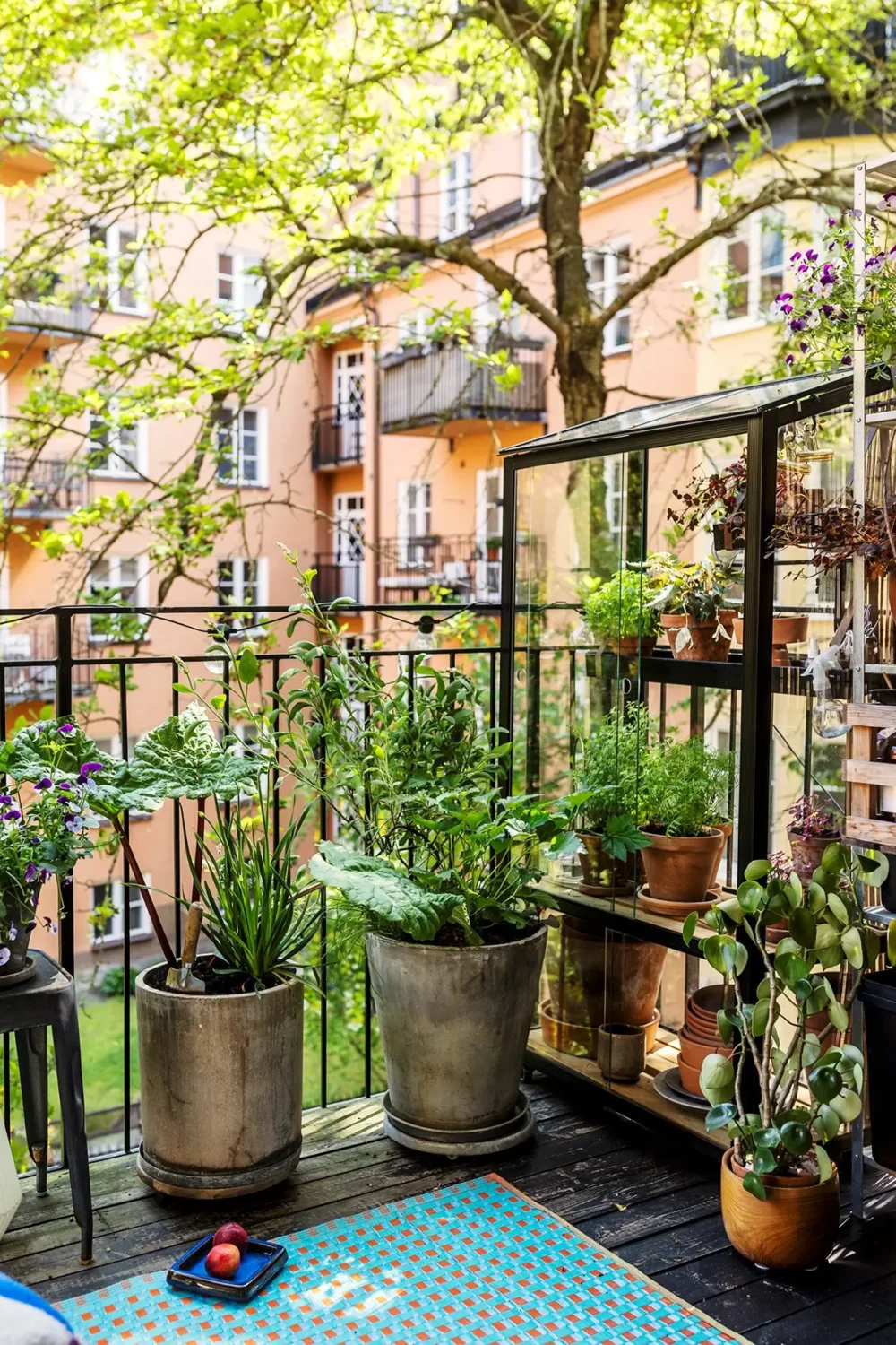 A Charming Swedish Courtyard Apartment Filled with Art 5 green balcony