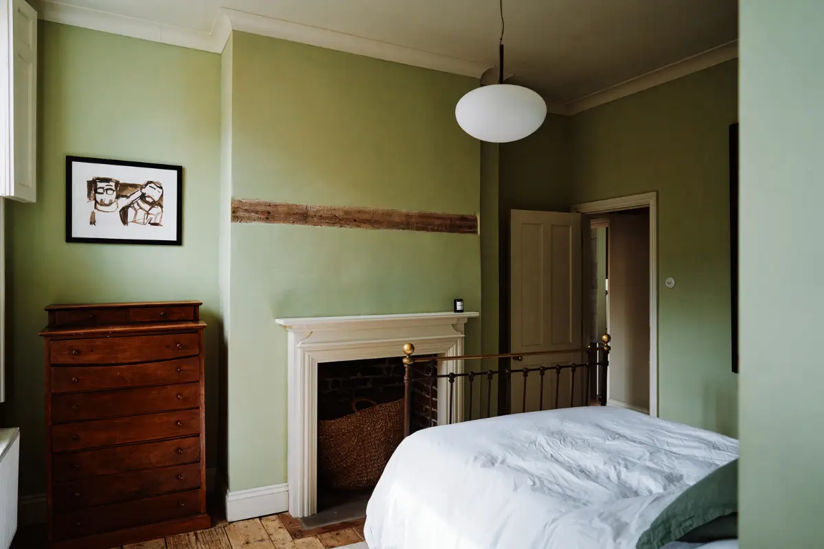 Restored Features in a Charming Georgian Apartment in London 13 green bedroom fireplace