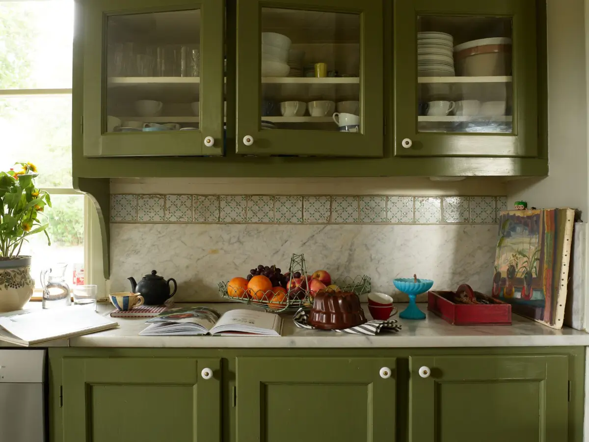 A Well-Preserved 1920s House with a Green Kitchen in Stockholm 5 green kitchen cabinets
