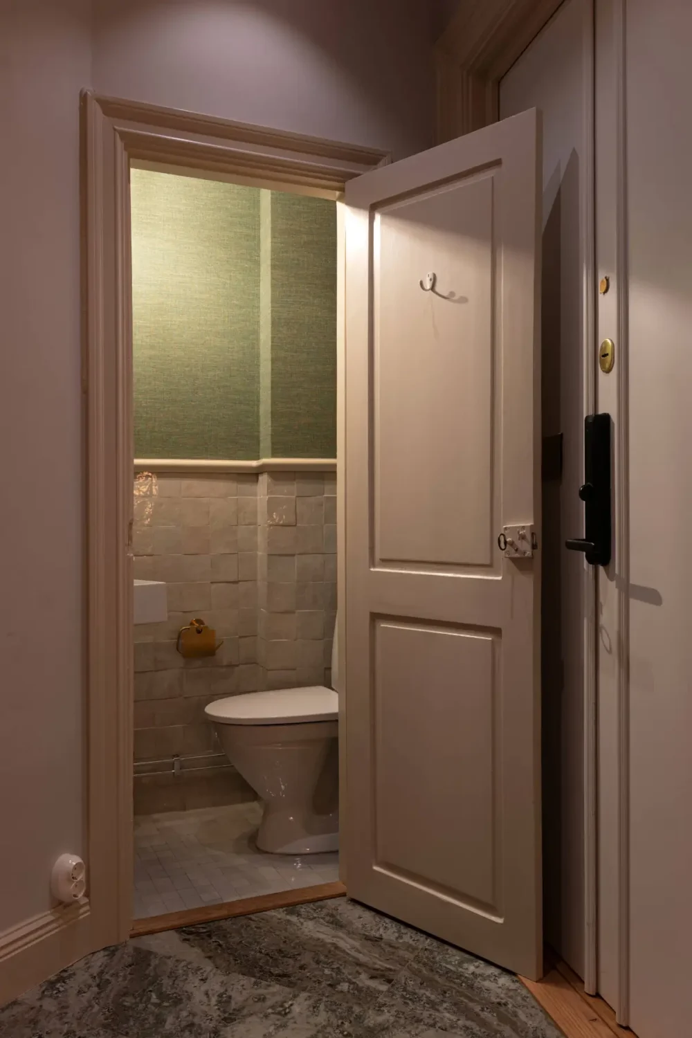 A Luxurious Family Apartment with a Dramatic Black Bathroom 34 guest toilet green wallpaper