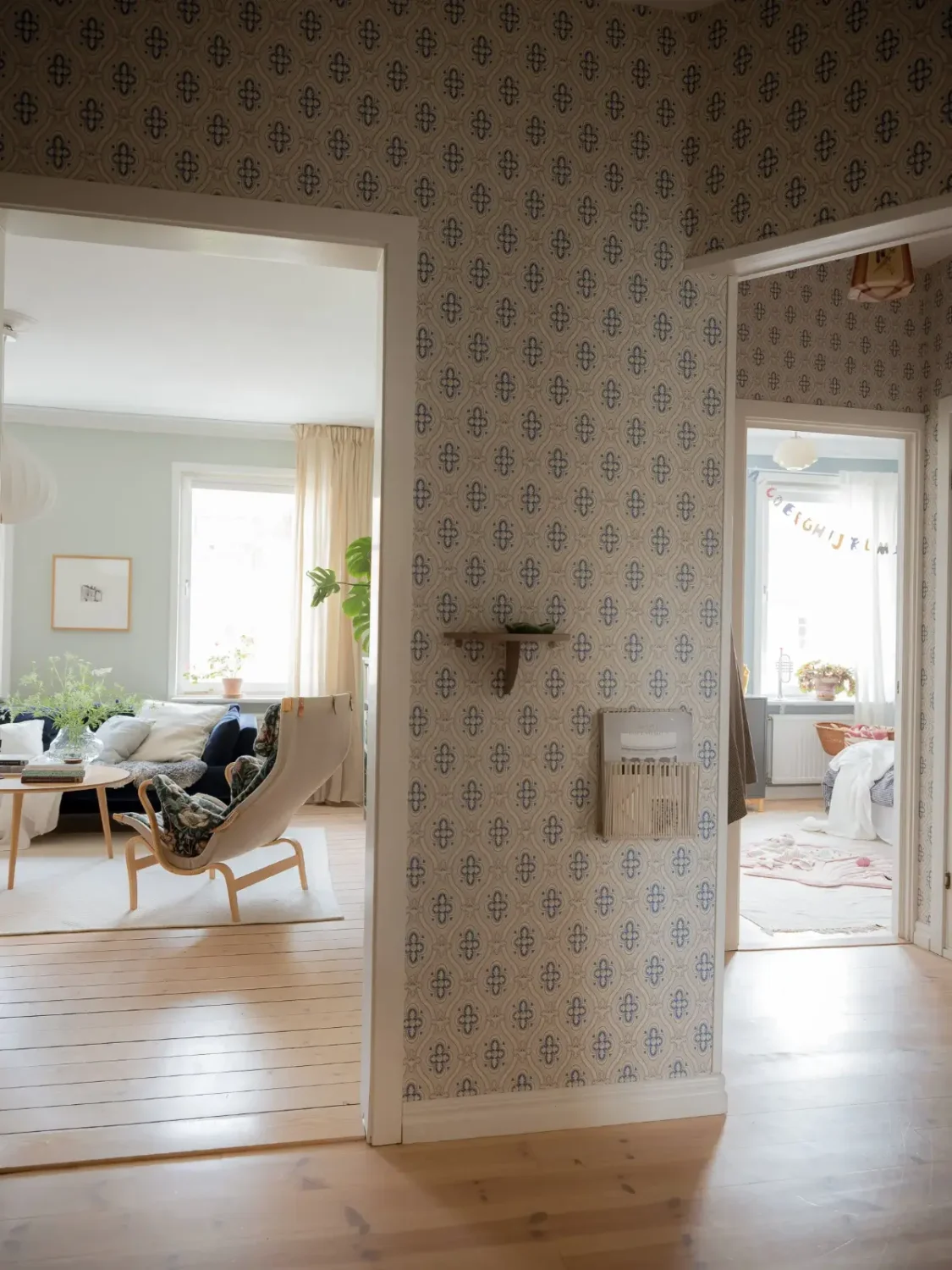 A Cozy Apartment with Exposed Brick and Period Details 16 hall blue wallpaper A Cozy Apartment with Exposed Brick and Period Details