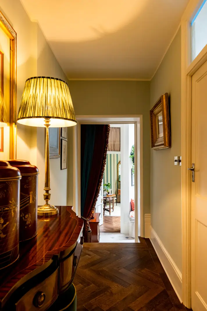 A Mixture of Patterns, Colors, and Materials in a Stunning London Apartment 7 hall herringbone parquet floor