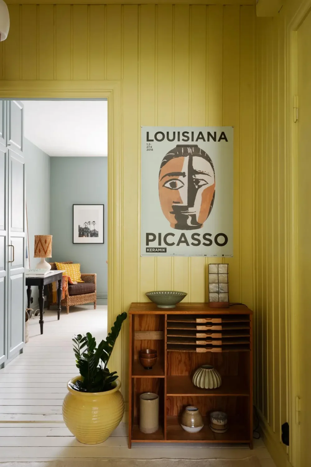 hall open cabinet yellow paneling