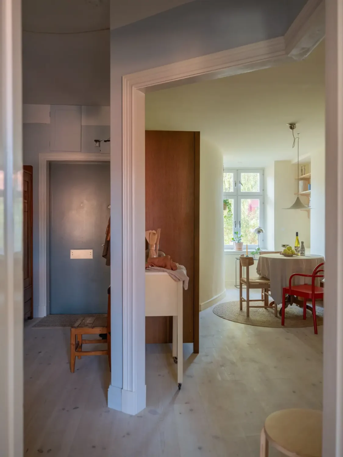 A Bright Apartment Where Historic Character Meets Contemporary Design 32 hall open doorway kitchen