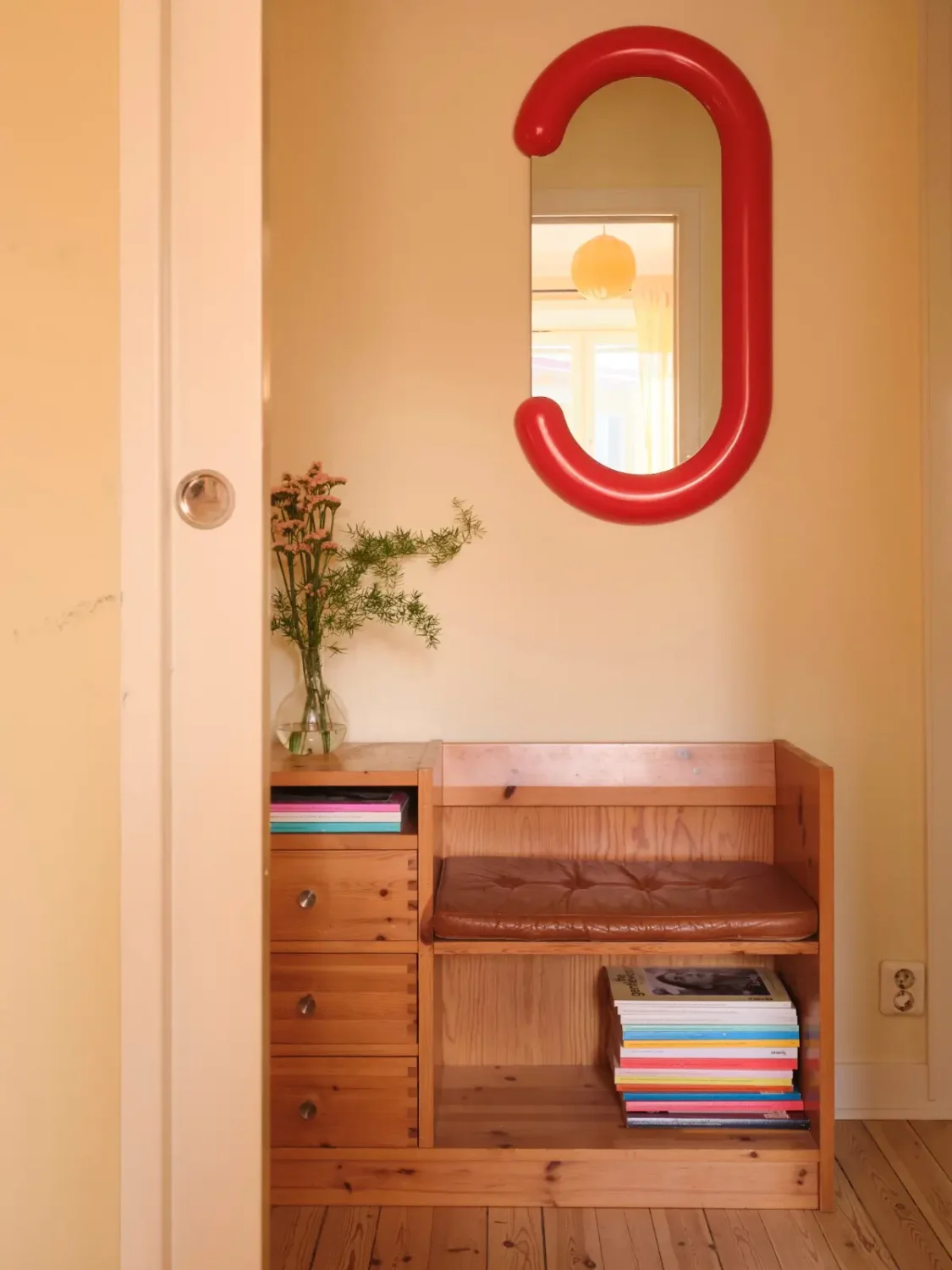 Soft Beige Interiors with the Occasional Bright Color Pop in Stockholm 22 hall red mirror