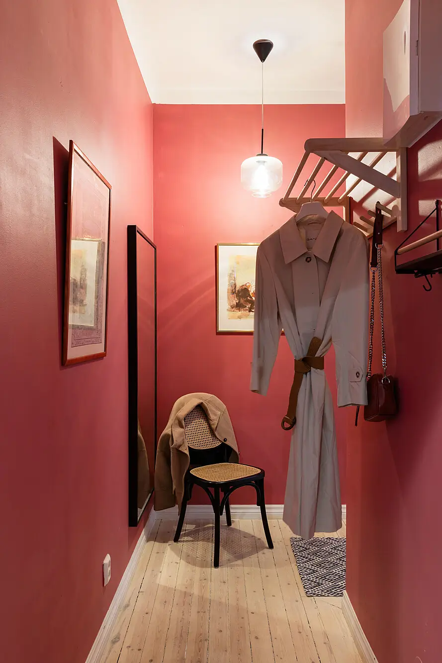 Red and Blue Color Accents in an Open-Plan Stockholm Apartment 19 hall-red-walls-wooden-floor