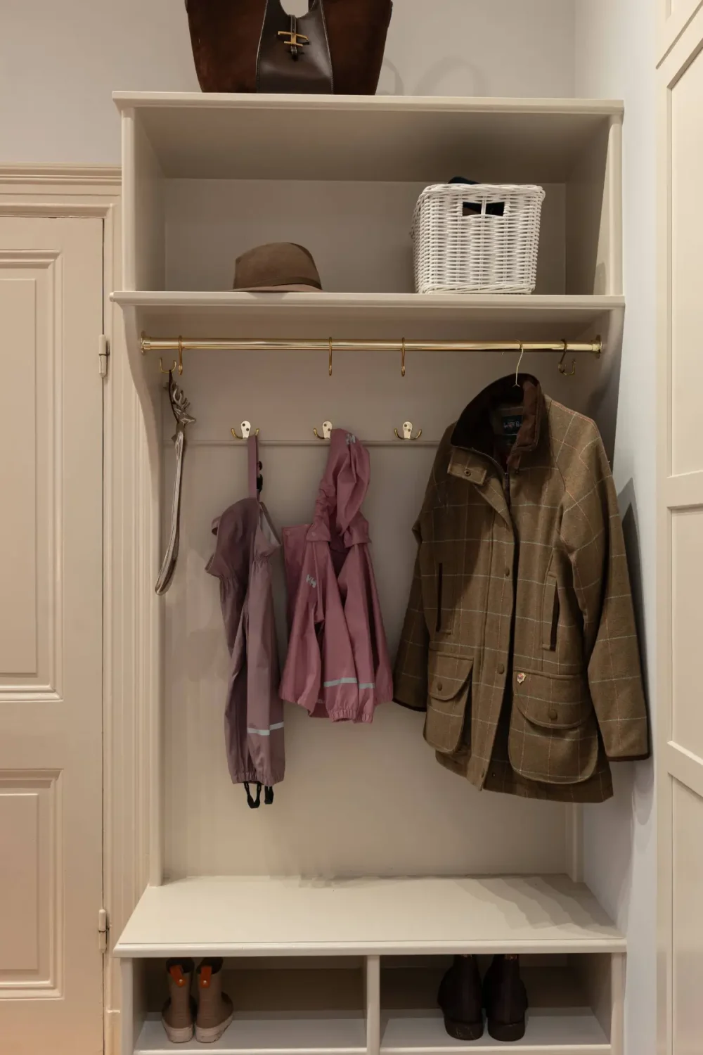 A Luxurious Family Apartment with a Dramatic Black Bathroom 36 hall storage A Luxurious Family Apartment with a Dramatic Black Bathroom