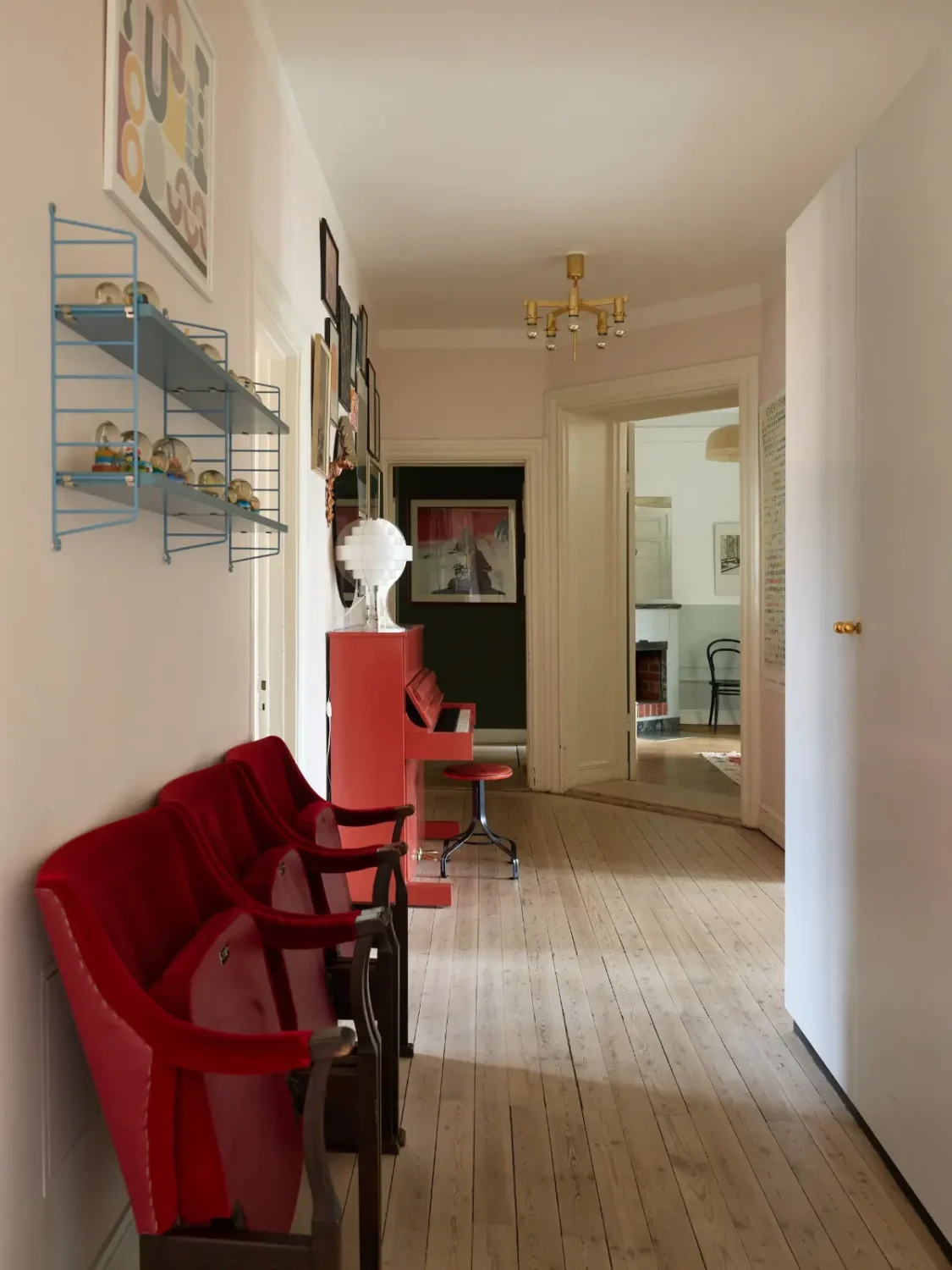 A Spacious Family Apartment with Original Details in Stockholm 13 hall with cinema chairs