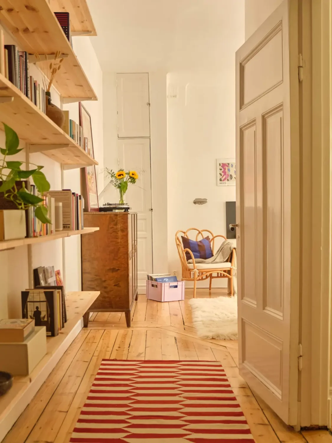 A Lush Balcony and Charming Rooms in a Late 19th Century Apartment 17 hall wooden shelves rug