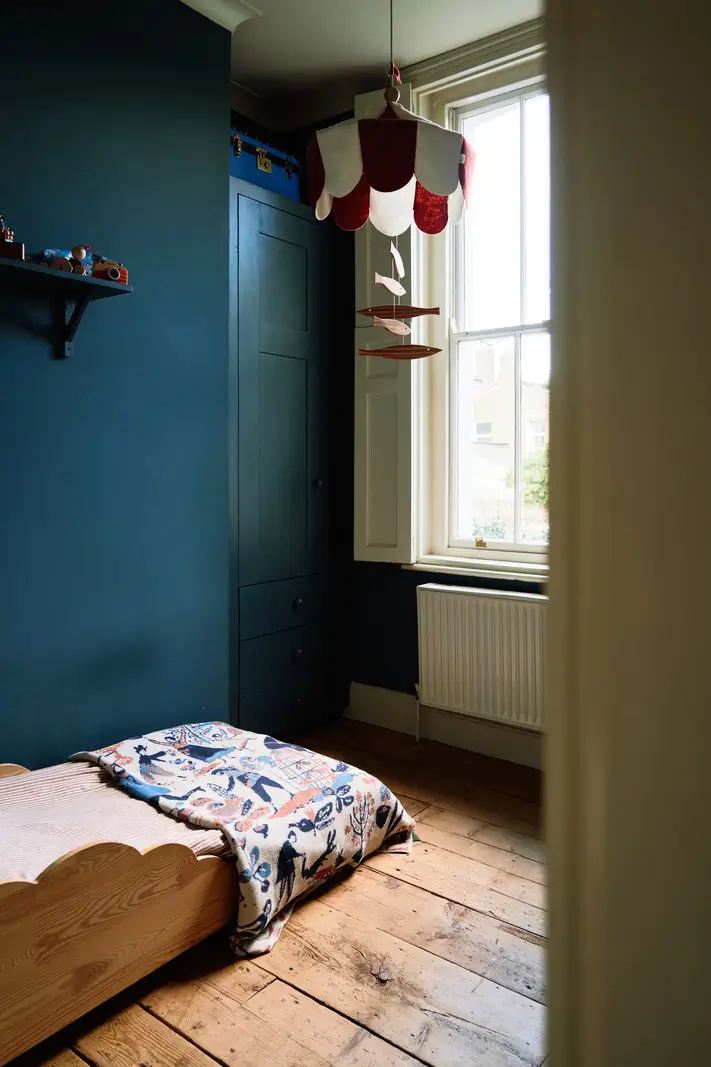 Restored Features in a Charming Georgian Apartment in London 18 kids bedroom timber floor blue wall