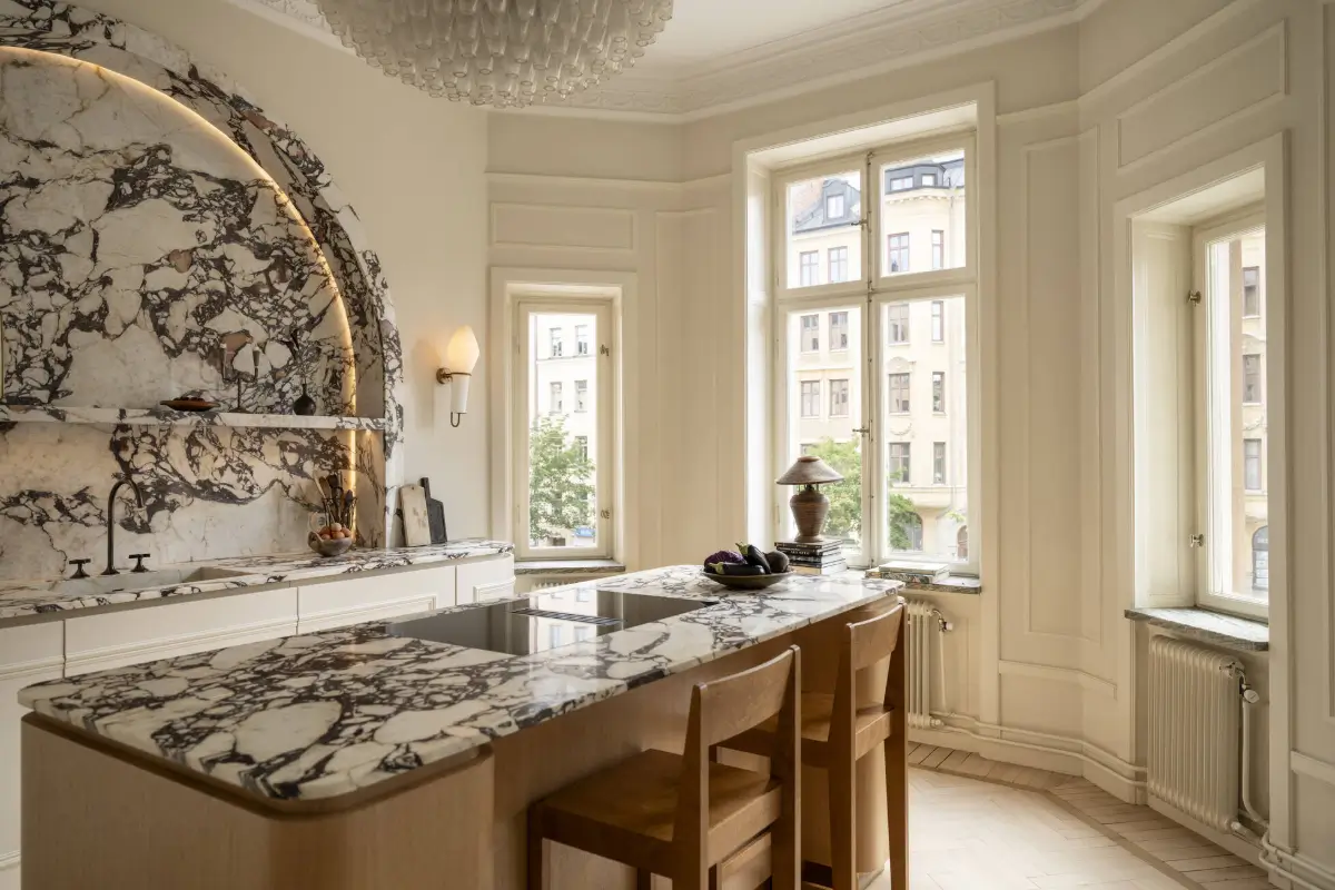 Luxurious Design and Period Features in a Stunning Stockholm Apartment 6 kitchen brec viola marble countertop backsplash nordroom