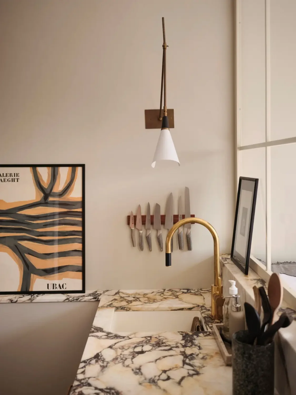 Warm Pink Walls and a Glass Room Divider in a Small Stockholm Apartment 21 kitchen detail