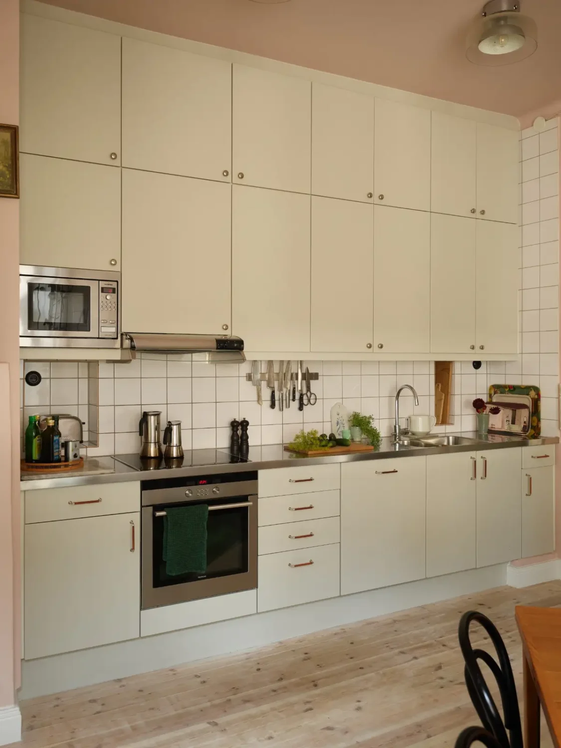 A Spacious Family Apartment with Original Details in Stockholm 16 kitchen white backsplash tiles