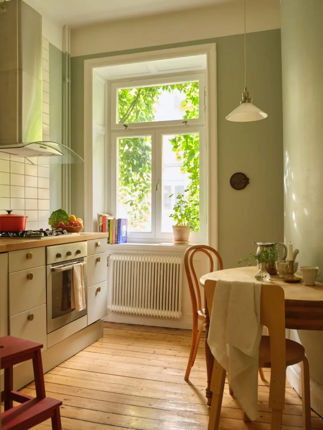 A Lush Balcony and Charming Rooms in a Late 19th Century Apartment 18 kitchen green walls small wooden table nordroom