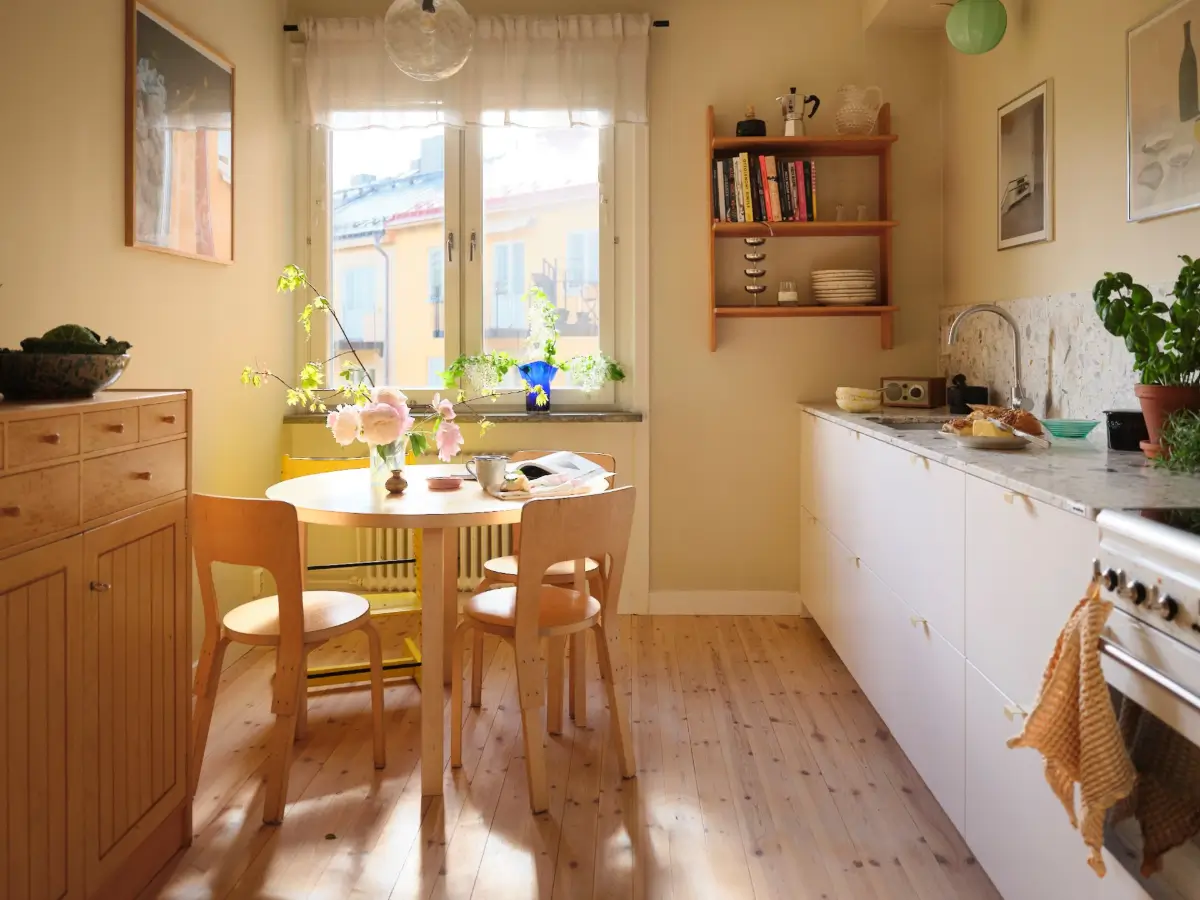 kitchen white cabinets terrazzo countertop round table